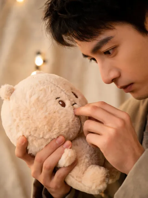 Material reviewer checking seams on plush toy