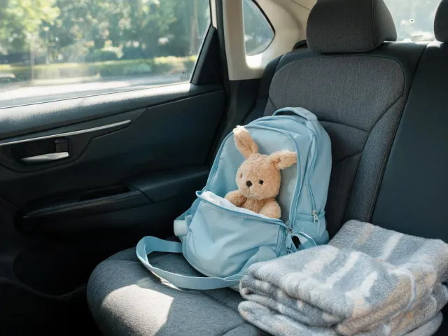 Travel backpack with plush comfort toy